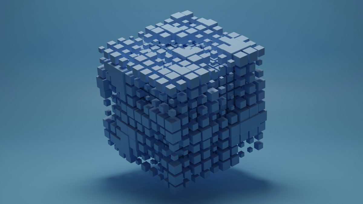 Cube assembled from small blue blocks